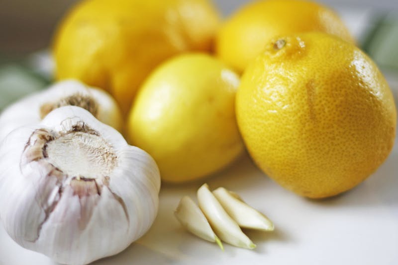Garlic bulbs and cloves with lemons