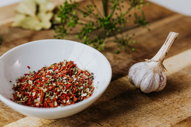 garlic bulb and bowl of spices