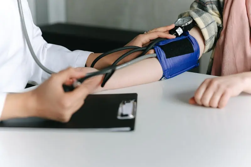 healthcare-worker is measuring blood pressure patient