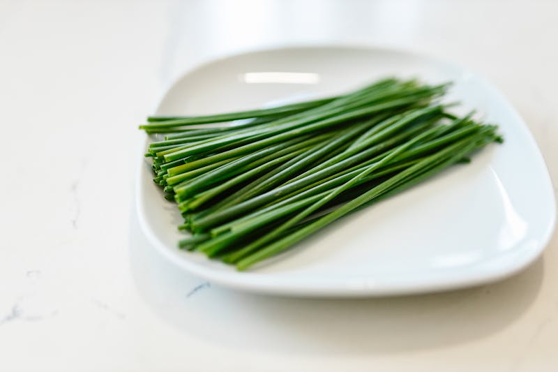 fresh garlic chives on a plate
