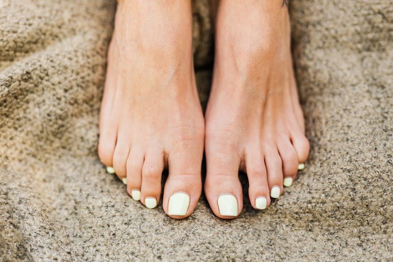 female feet with painted nails