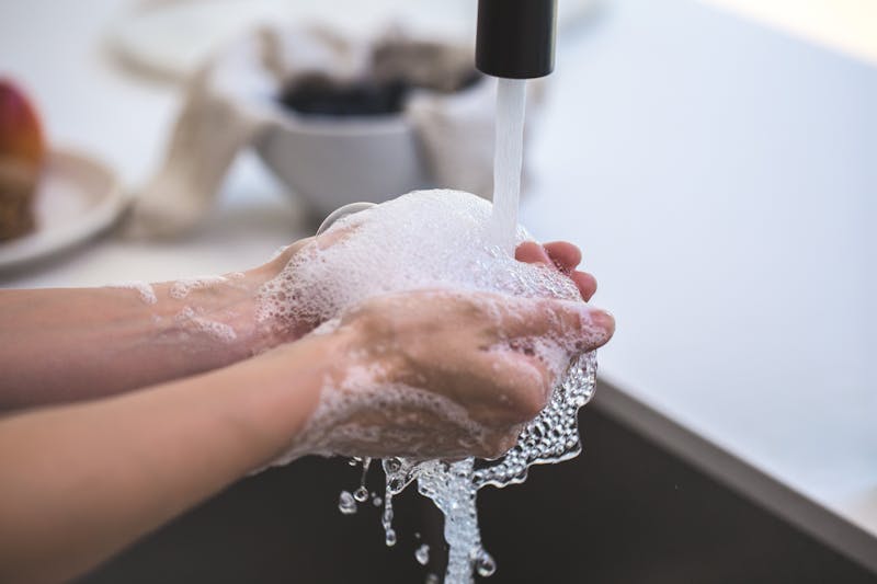 washing hands with warm water and soap