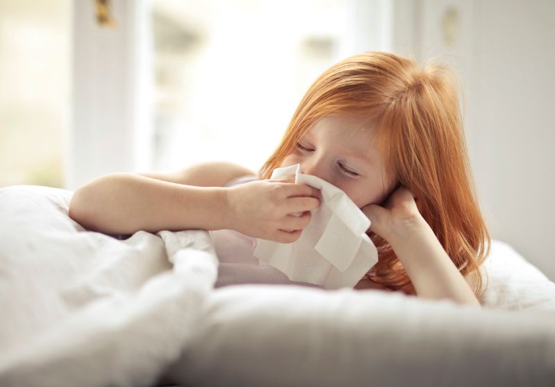 a child with a cold and a runny nose