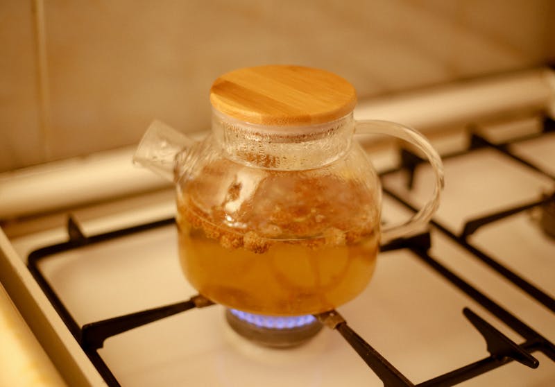 chamomile and lemon balm tea in a pot on a brunner