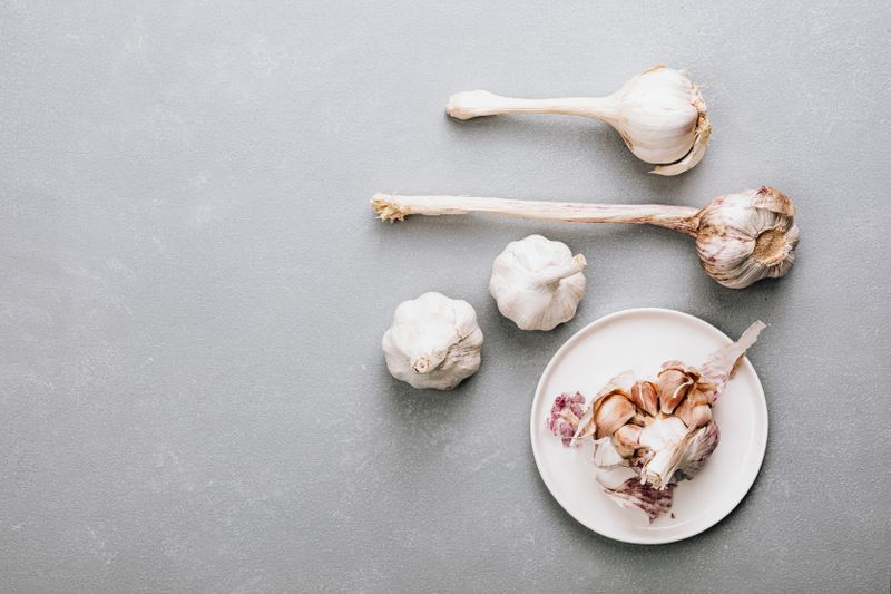 white garlic bulbs on the table