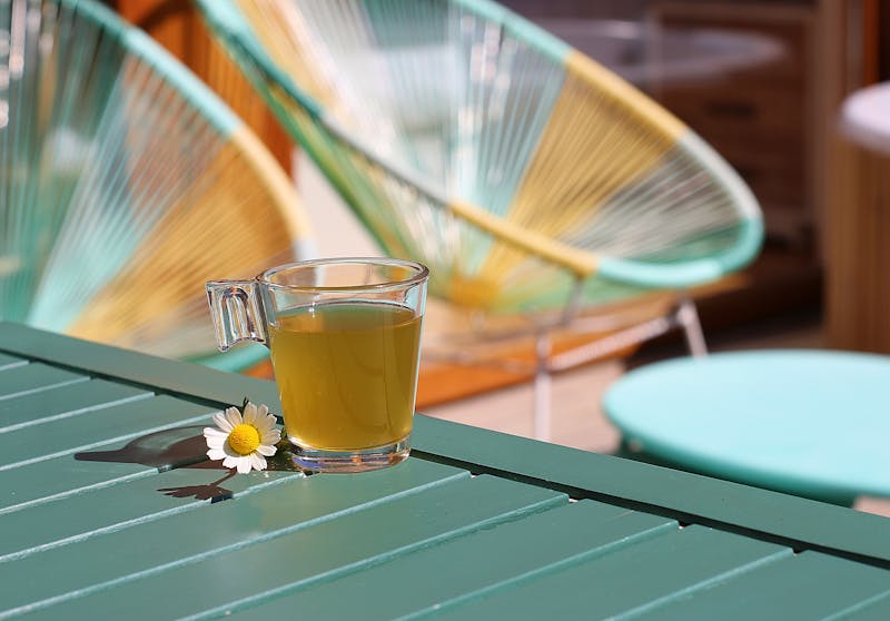 glass of lemon balm and chamomile tea on the table