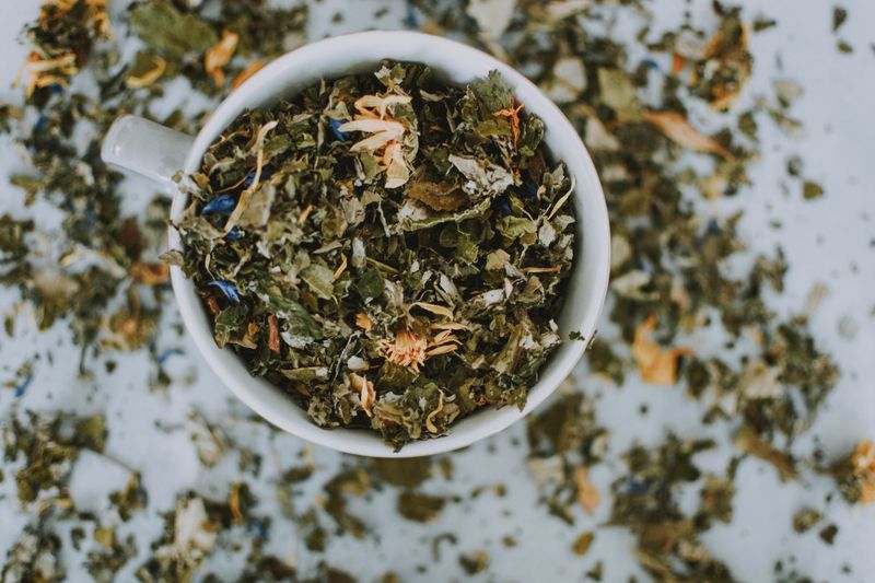 blend of dried herbs with lemon balm in a bowl