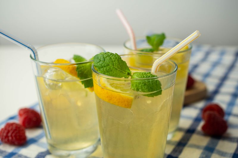 drink with lemon balm and lemon in glasses