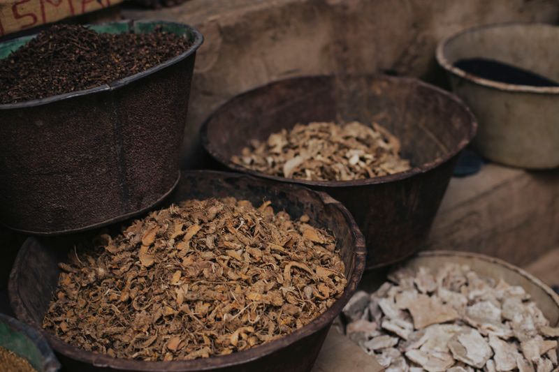 valerian root and other herbs in big, metal bowls
