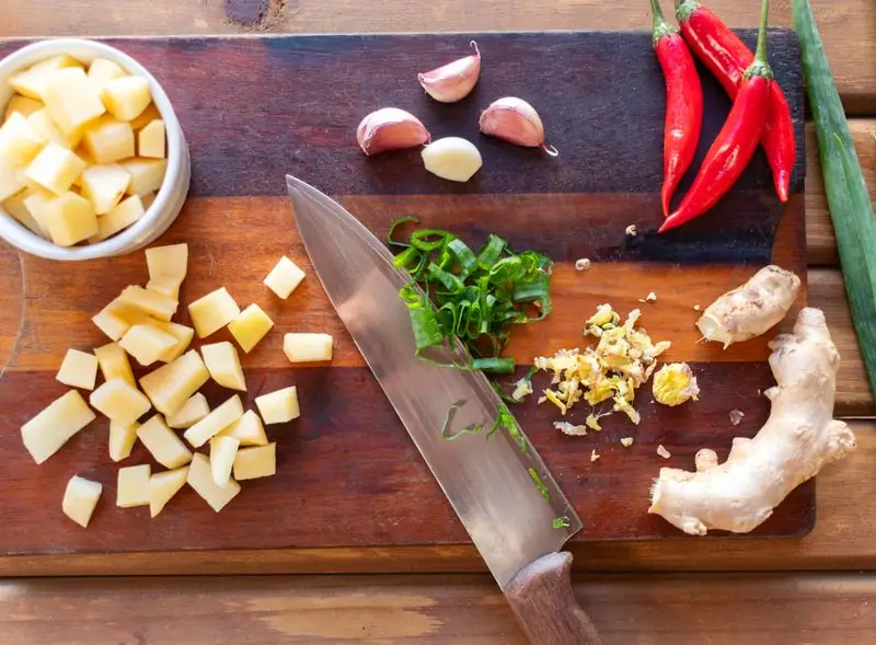 ginger with garlic and pepper on a choping board